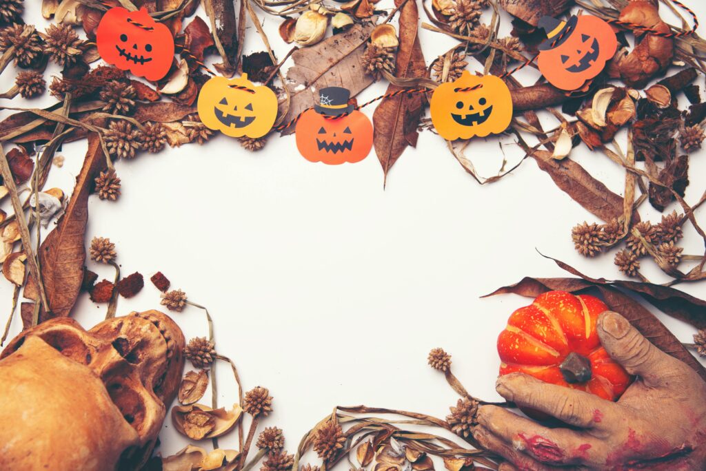 Halloween paper pumpkins on a white background