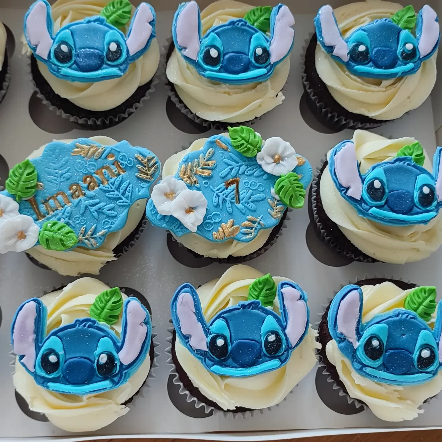 Cupcakes with the character Stitch as a topper